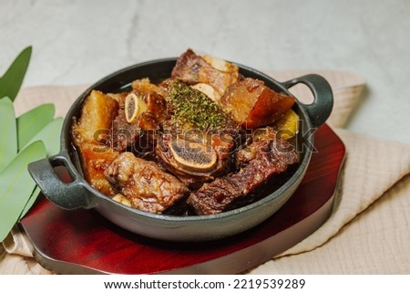 galbijjim, Korean Braised Short Ribs : Beef short ribs, trimmed of fat, seasoned in sweet soy sauce, and braised until tender with carrots, chestnuts, ginko nuts, and other vegetables.