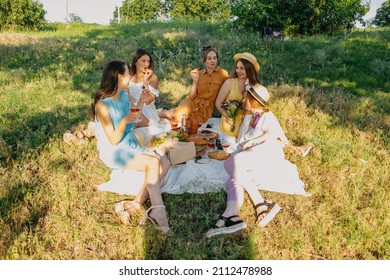 Galentines Day. Slumber Party. Summer Picnic Party Ideas, Outdoor Gathering With Friends. Young Women Girl Friends Drinking Wine, Laughing, Having Fun Together At Picnic.