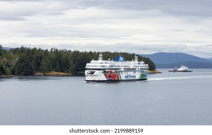 Galiano Island, British Columbia, Canada - June 21, 2022: BC Ferries Boat In Pacific Ocean During Cloudy Summer Day.