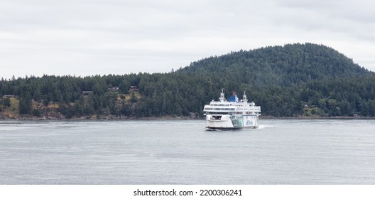 Galiano Island, British Columbia, Canada - June 22, 2022: BC Ferries Boat In Pacific Ocean During Cloudy Summer Day.