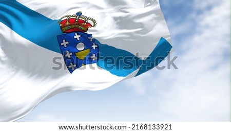 The Galicia flag waving in the wind on a clear day. Galicia is an autonomous community of Spain and historic nationality under Spanish law