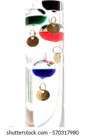 Galileo thermometer with glass balls isolated on white showing temperature - Shutterstock ID 570317980