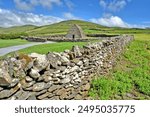 The Gallarus Oratory in sunshine -  a chapel located on the Dingle Peninsula, County Kerry, Ireland.