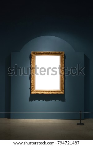 Gallery Interior with empty frame on blue wall