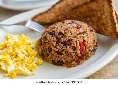 Gallopinto (black beans and rice) typical Costarican breakfast. Served with scrambled eggs and toast bread.