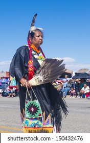 GALLUP , NEW MEXICO - AUGUST 10 : Native American woman with traditional costume participates at the 92 annual Inter-tribal ceremonial parade on August 10 , 2013 in Gallup New-Mexico