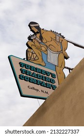 Gallup, New Mexico, USA, February 10, 2019 - Low angle view of Turney’s Trading Company vintage sign at 207 S 3rd Street featuring a Native man