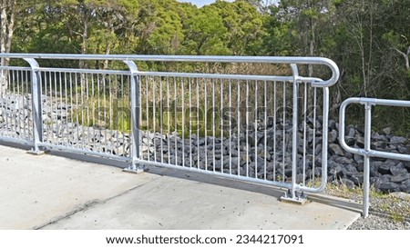 Galvanised metal railing on a bridge