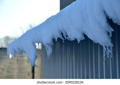 Galvanized Metal Roof In The Mountains With A Bar Against The Rapid Sliding Of Snow. If Snow And Ice Quickly Fall On People Under The Roof, They Will Be Injured Or Dead. Slows Down 