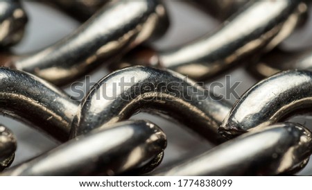 galvanized steel chain for wearing watches close-up, macro of togetherness of rings of one chain, concept of unity