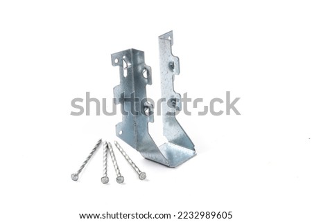 A galvanized steel joist hanger with nails as might be used n residential construction