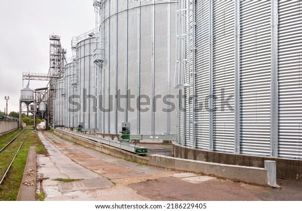 Galvanized steel silos for grain\
storage. Railway access roads for loading railway cars with\
grain.
