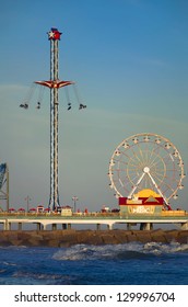 Galveston Pleasure Pier Captured At Dusk On A Sunny Day