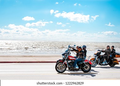 Galveston, TX, US - Nov 03, 2018: Bikers cruise along the Seawall in Galveston during the Lone Star Rally in Galveston Texas.