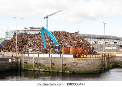 Galway, Ireland - 04.02.2021: Heap of old rusty scrap metal ready to be loaded on a ship for transportation