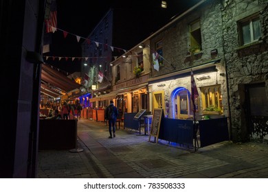 GALWAY, IRELAND - December 10, 2017:  Nightlife On Quay Street In The Heart Of Galway's Latin Quarter.