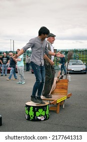 Galway, Ireland - July, 03. 2022: Old Bearded Man And Young Asian Man Dancing Irish Step Dance At Classic Fest 2022. 