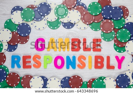 Gamble Responsibly and know when to quit in a conceptual image with assorted denominations of casino chips forming a frame around colorful text viewed from above