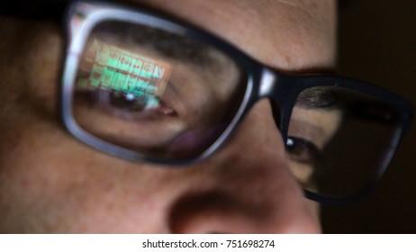 Gambling addicted man with glasses in front of online casino slot machine on laptop computer at night - loosing his money. dramatic low light film grain shot - Shutterstock ID 751698274