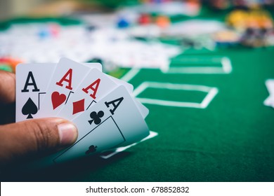Gambling Chips And Cards On A Green Cloth Casino Table