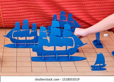 The Game Of Battleship Large Models Of Sailing Ships. The Field Is Divided Into Cells, Sailboats And Chalk To Indicate Hit. Sea Battle As A Board Game Version For Two Players.