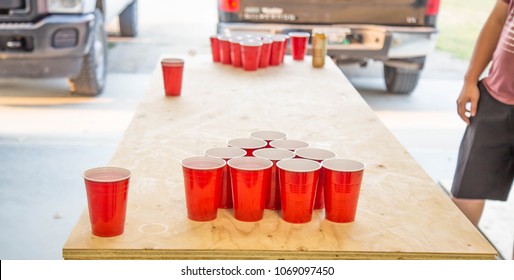 Game Beer Pong On Wooden Table