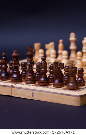 A game of chess, the beginning of a chess game two sides opposite each other. Business rivalry and planning, concept
