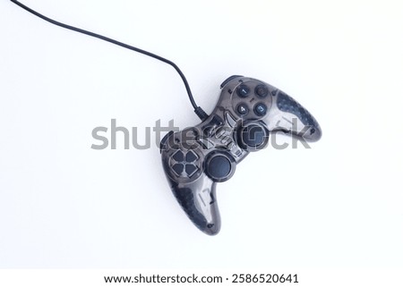 Game controller with wire on white  background, top view. 