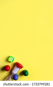 Game cubes, chips, hourglass on a yellow background. The concept of home Board games, classes at home with children, developmental training, logic games. Flatlay and space for text - Shutterstock ID 1733799281