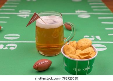 Game Day Beer And Snacks On Table Decorated For The Superbowl