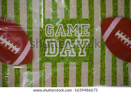 Game Day Football Party Banner with Footballs and a Gridiron Field