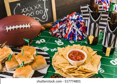 Game day football party table with beer, chips and salsa.
