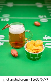 Game Day Football Snacks And Cold Beer On Table Decorated With Yard Lines