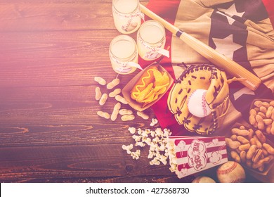 Game day traditional snacks included corndogs and salted peanuts on a wood board. - Powered by Shutterstock