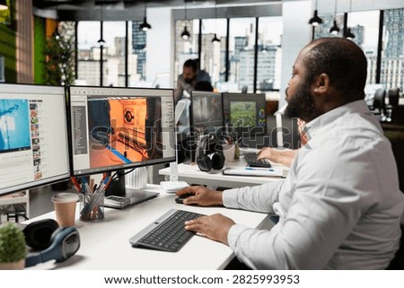 Game engineer programs gameplay systems for a digital gaming project, building futuristic spatial environments with modern software and cloud computing tools, expanding the game environment