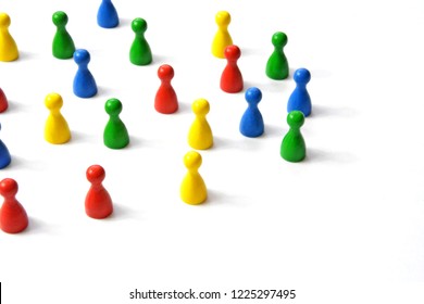 Game figures from a board game in different colors stand on a white background and throw all the shadows in one direction - concept with different figures on white background - Shutterstock ID 1225297495