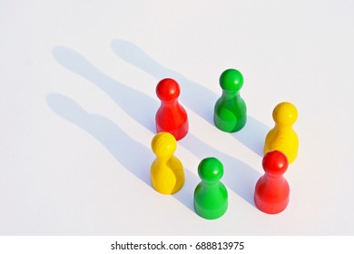 Game figures form a circle as a symbol for a team - Shutterstock ID 688813975