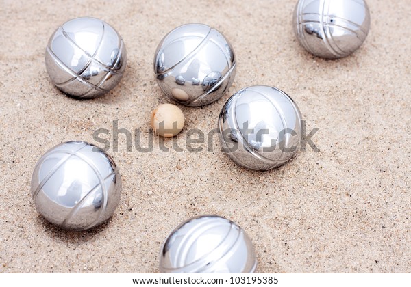 Game of jeu de boule, silver metal balls in sand. A\
french ball game