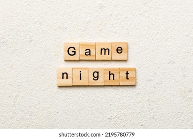 Game Night Word Written On Wood Block. Game Night Text On Cement Table For Your Desing, Concept.