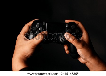 Game pad, Game Controller, hand holding game pad controller  with black background