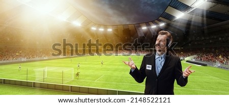 Game predictions. Serious man, professional sport commentator having online broadcast of football match isolated over sport stadium background. Sport news, information. Concept of profession, emotions