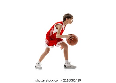 Game Spirit. Studio Portrait Of Teen Boy Playein Basketball, Training Isolated Over White Background. Popular Sport. Concept Of Sport, Active Lifestyle, Health, Team Game And Ad