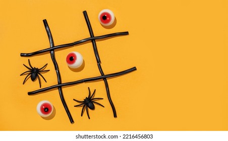 Game Tic-tac-toe From Spiders And Eyes On Orange Background. Halloween Party