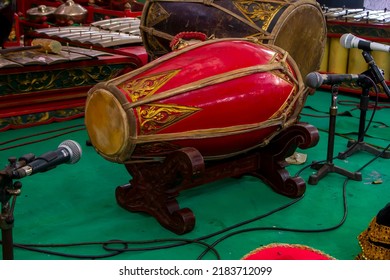 GAMELAN. Indonesian Javanese musical instrument. Javanese men playing gamelan, drums, bonang or other famous Javanese traditional musical instruments.