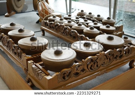 Gamelan is the traditional ensemble music of the Javanese, Sundanese, and Balinese peoples of Indonesia, made up predominantly of percussive instruments.  The kemanak (a banana shaped idiophone).