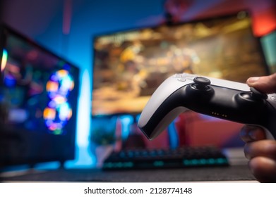 Gamepad, Personal Computer, Big Screen TV. Neon Lighting. Video Games, Game Strategy, Esports, Cyberspace, Virtual Reality. There Are No People In The Photo.