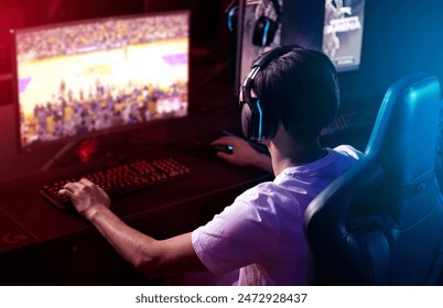 Gamer, computer screen and man with headphones, night and esports subscription from back. Content creator, influencer or streamer with headset for online challenge, video game or live stream at home. - Powered by Shutterstock