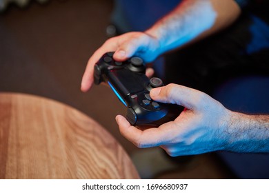 Gamer holding Gamepad, Controller or Videogame Joystick Console in hands. Close up, game concept