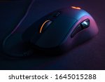 Gamer mouse, with contrasting lighting and colors that refer to technology