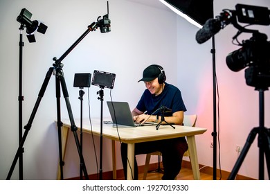 Gamer, streamer, or Youtuber streaming and recording in his home studio